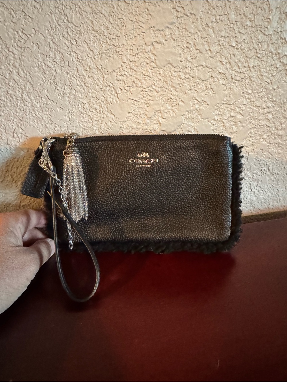 Coach Black Pebbled Leather Wristlet with Tassel Charm
